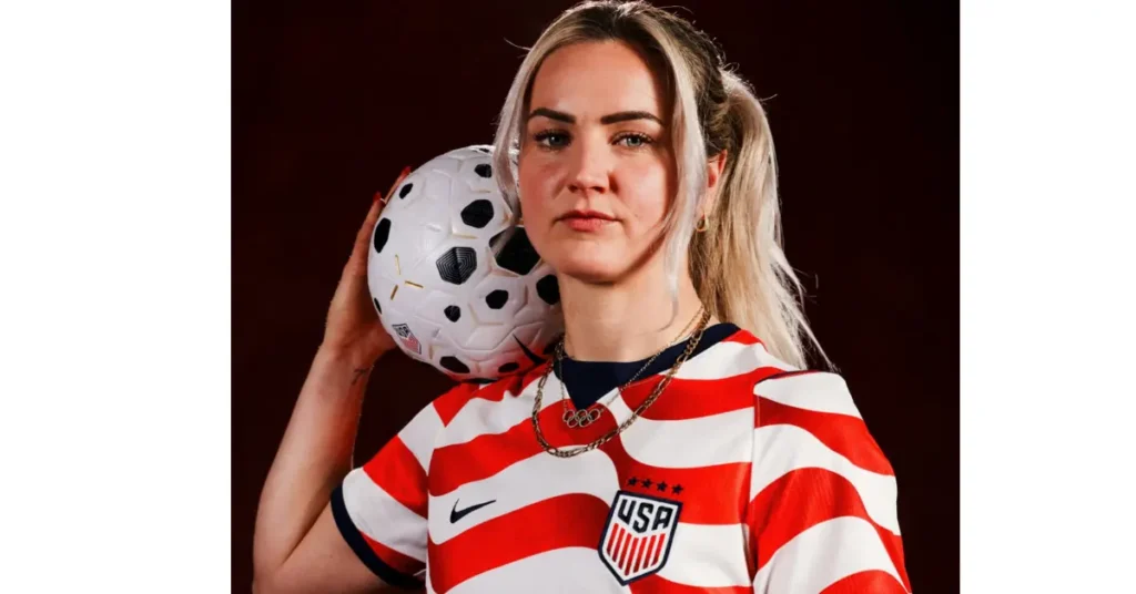 USWNT captain Lindsey Horan holding a soccer ball in the new 2024 Nike home jersey.